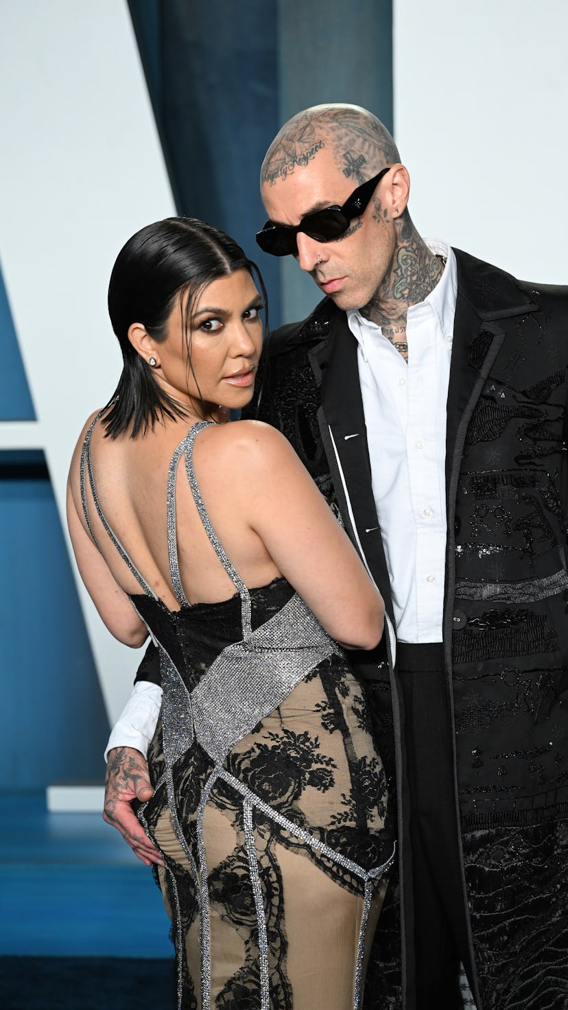 BEVERLY HILLS, CALIFORNIA - MARCH 27: Kourtney Kardashian and Travis Barker attend 2022 Vanity Fair ...