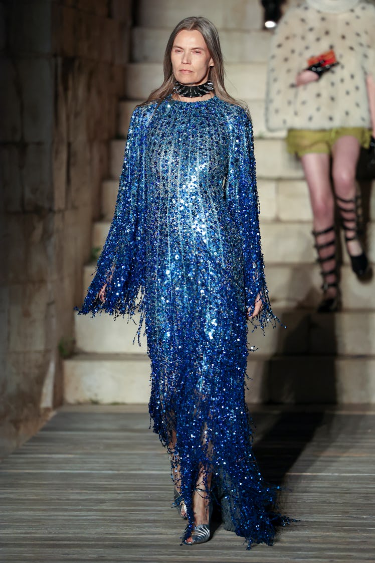 A model walking the runway during Gucci Cosmogonie at Castel Del Monte in a blue gown