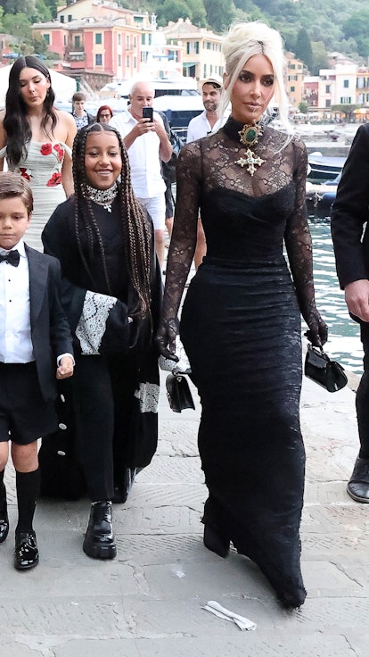 Kim Kardashian wears Dolce & Gabbana as she attends Kourtney Kardashian's wedding with daughter Nort...