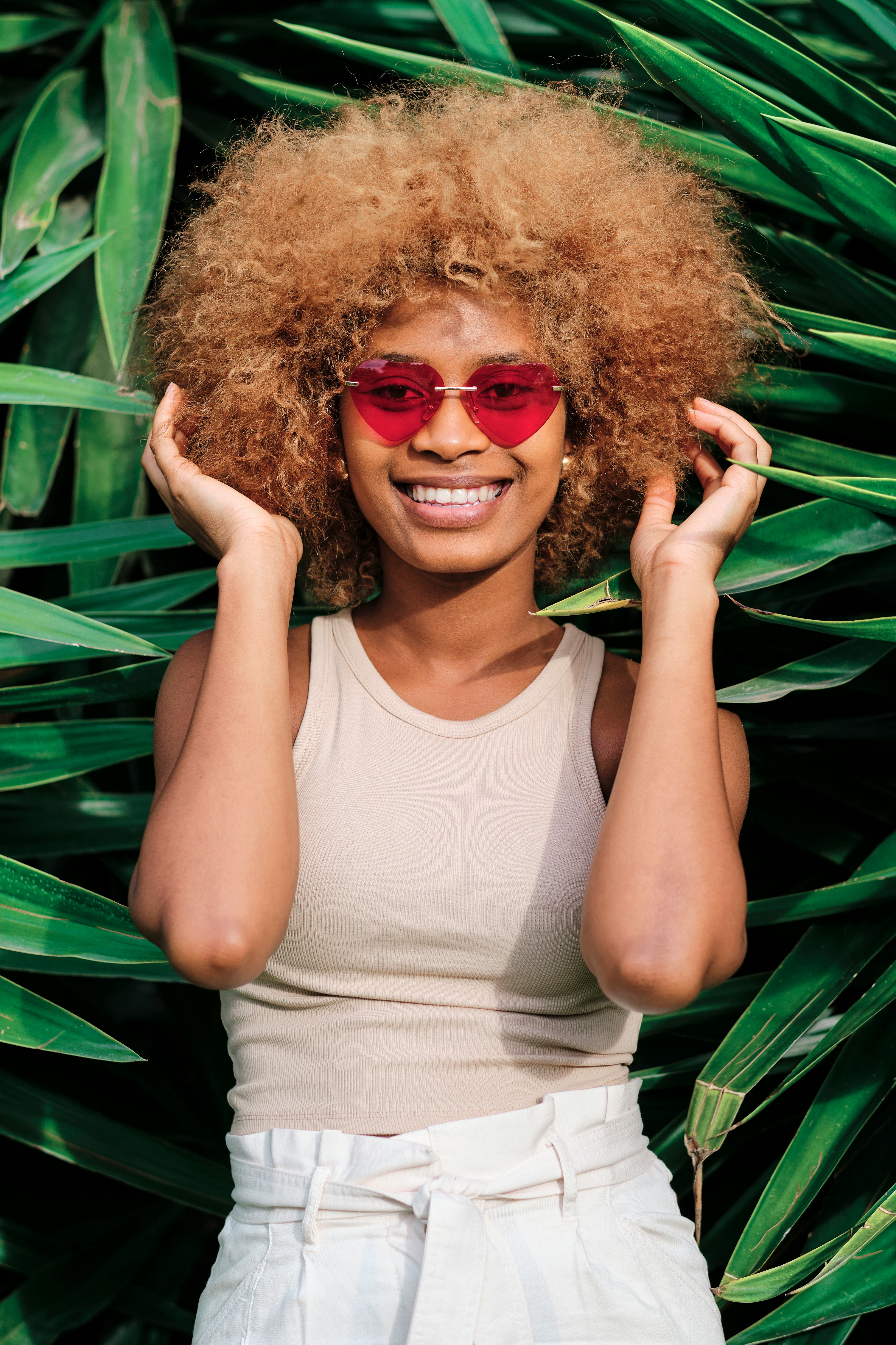 Young woman holding her hair on June 19, 2022, the most romantic day of the month for every zodiac s...
