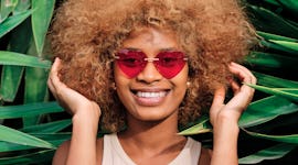 Young woman holding her hair on June 19, 2022, the most romantic day of the month for every zodiac s...