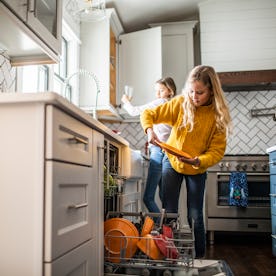 Washing and putting away the dishes is a common chore for tweens.
