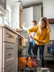 Washing and putting away the dishes is a common chore for tweens.