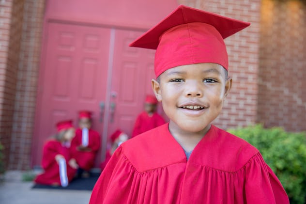 little boy in graduation cap, pre-k graduation instagram captions