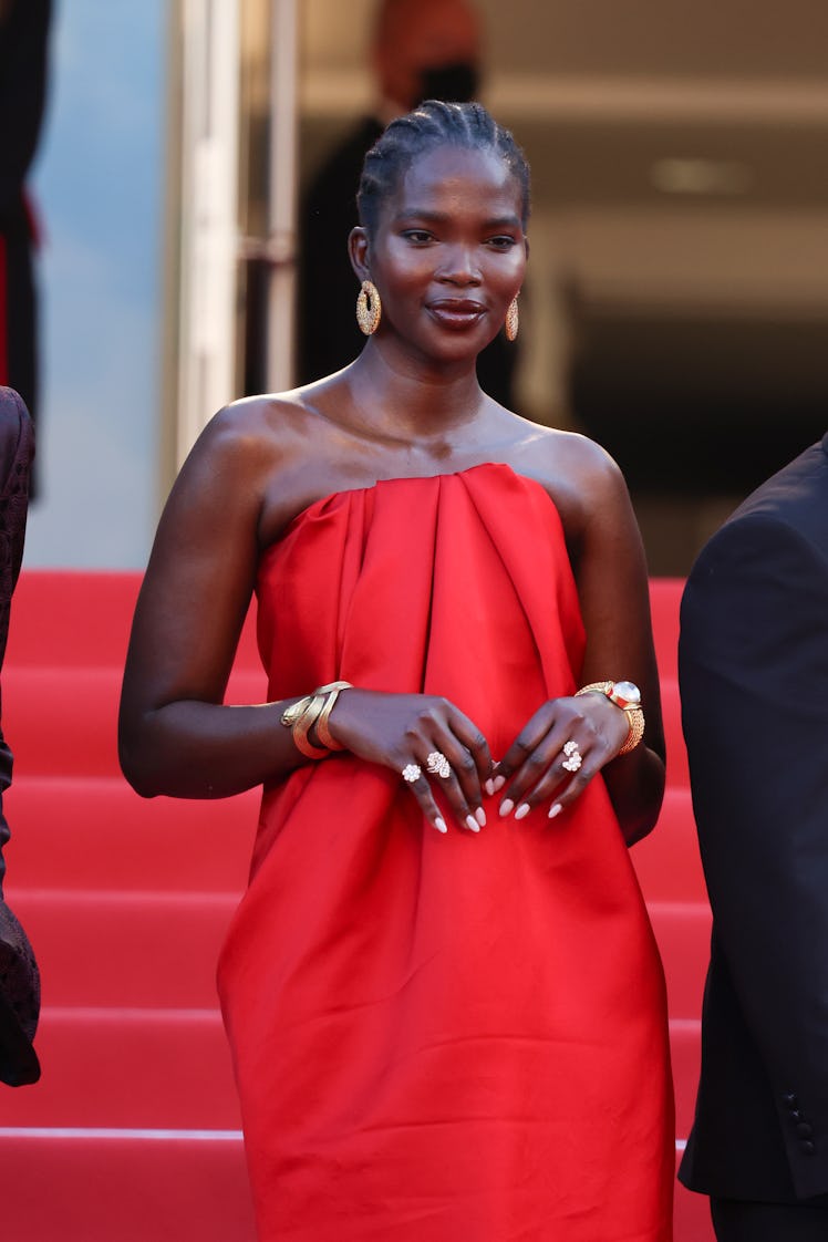 Aamito Lagum in a strapless red gown at the screening of "Three Thousand Years Of Longing the Cannes...