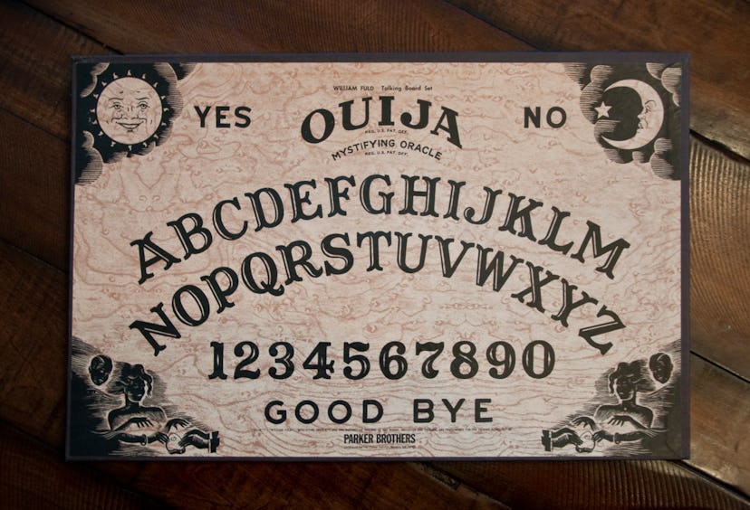 Bedford, NH USA - May 11, 2012: Ouija Board by Parker Brothers on wooden table