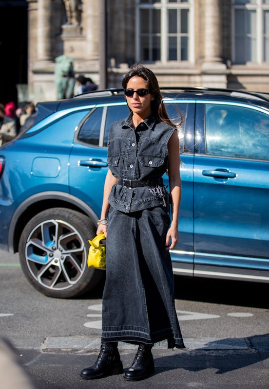 PARIS, FRANCE - MARCH 07: Nina Urgell Cloquell wearing sleeveless denim jacket, skirt seen outside S...