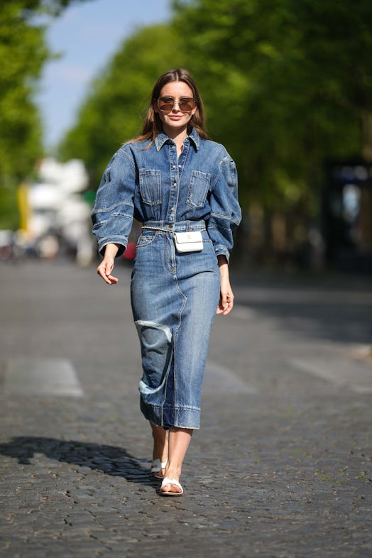 PARIS, FRANCE - APRIL 27: Diane Batoukina wears brown sunglasses from Dior, a blue faded / ripped ov...