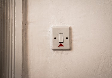 Photo taken in Sarajevo, Bosnia and Herzegovina, showing a light switch with two black screws on eit...