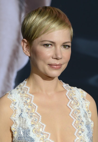 Michelle Williams wears a classic pixie cut with side-swept bangs to the premiere of "Venom."