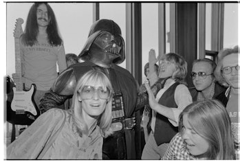 Members of Jefferson Starship and some of their friends party with Darth Vader of Star Wars.  (Photo...
