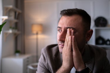 Sad frustrated millennial man suffering from stress