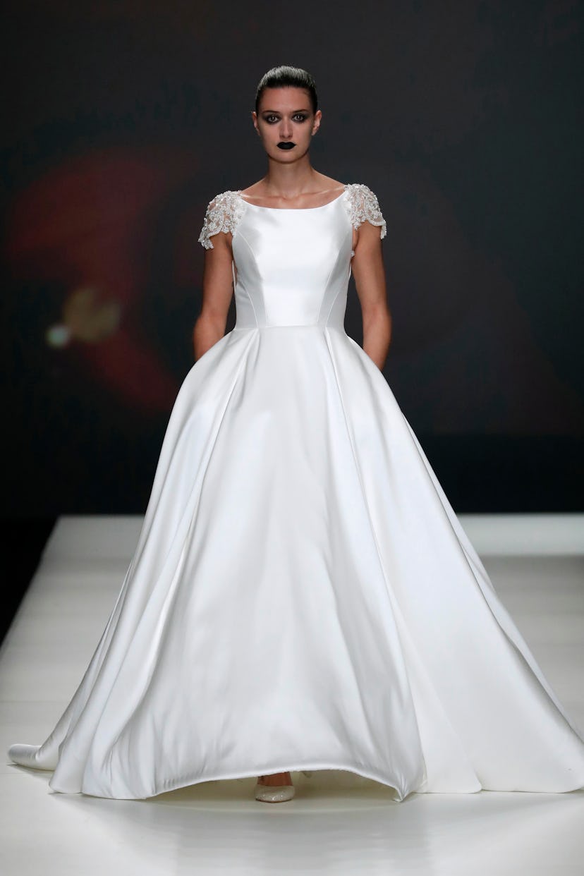 Wedding makeup & hair looks in  2022 on Pinterest are dark glam. Here, the Modeca show as part of th...
