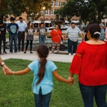 Members of the community gather at the City of Uvalde Town Square for a prayer vigil in the wake of ...