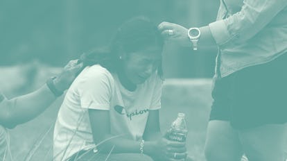 TOPSHOT - A girl cries, comforted by two adults, outside the Willie de Leon Civic Center where grief...