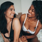 Two beautiful sexy women lesbian couple in the bed