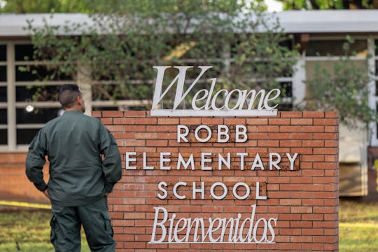 UVALDE, TEXAS - MAY 25: A law enforcement officer stands outside the Robb Elementary School on May 2...