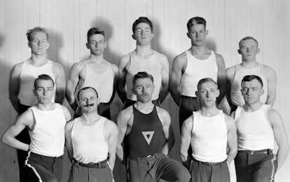 Rochester, NY gymnastics club wearing white tank tops in 1910s. 
