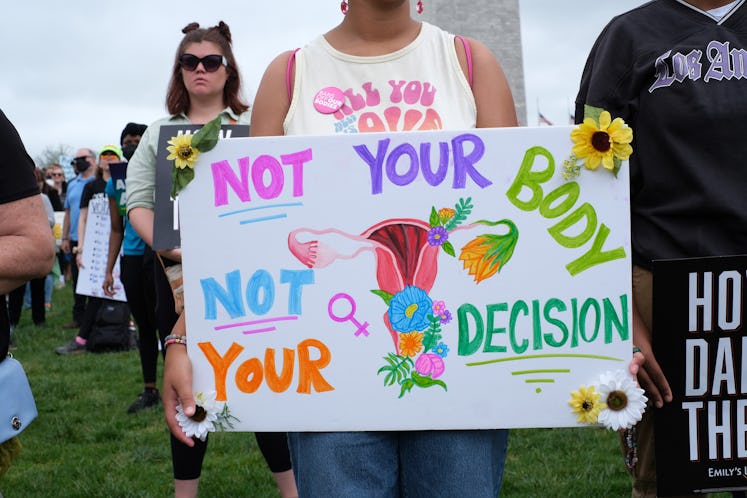 WASHINGTON, DISTRICT OF COLUMBIA, UNITED STATES - 2022/05/14: An abortion rights demonstrator holdin...
