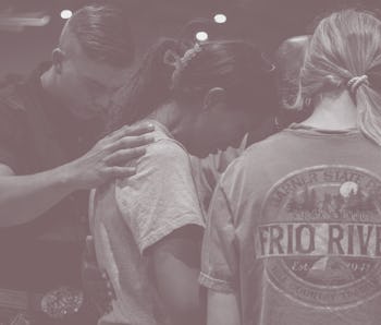 UVALDE, TEXAS - MAY 25: Community members mourn and pray together at a vigil for the 21 victims in t...