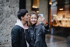 Happy couple taking selfie for social media