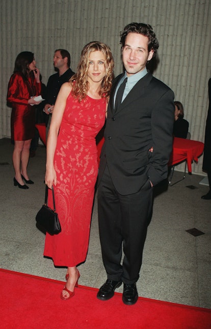 Jennifer Aniston and Raul Rudd together on the red carpet. She's wearing a red dress and he's wearin...