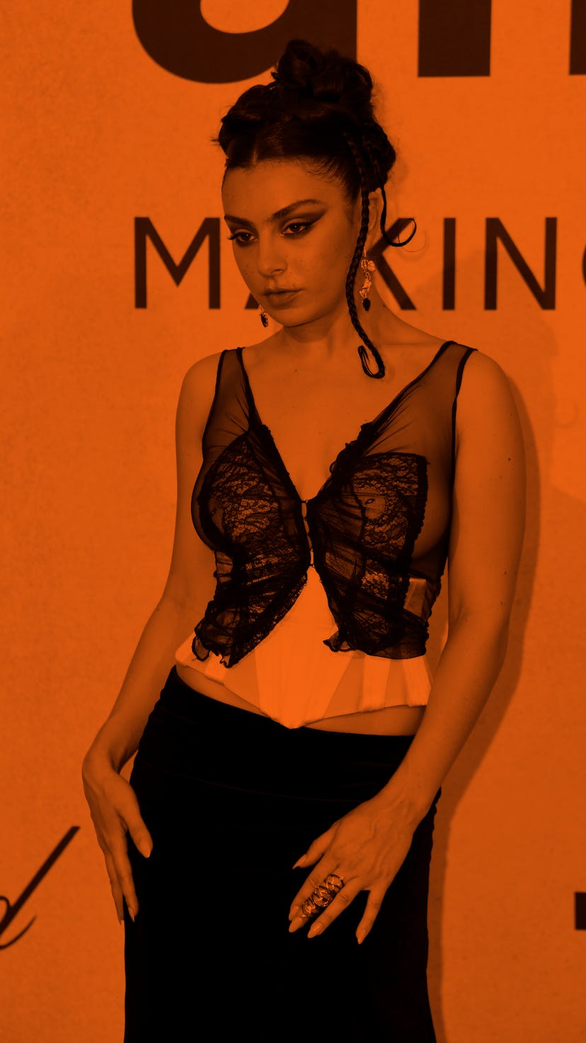 CAP D'ANTIBES, FRANCE - MAY 26: (EDITORS NOTE: Image contains nudity.) Charli XCX attending amfAR Ga...