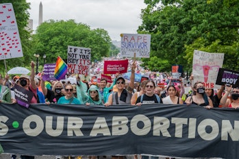 WASHINGTON, DC - MAY 14: Thousands of demonstrators march to the US Supreme Court during the Bans Of...