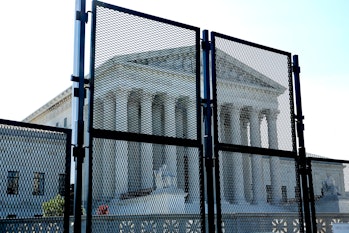 WASHINGTON, DC - MAY 23: Protective fencing remains up around the U.S. Supreme Court building in ant...