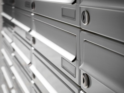 Modern Gray Mailboxes. They can be used for background and concepts. Shallow depth of field.