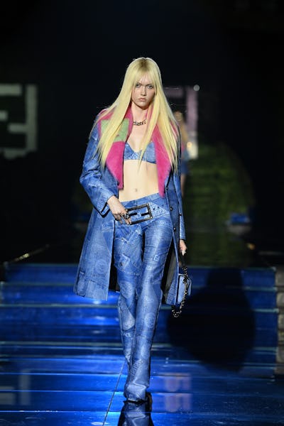 MILAN, ITALY - SEPTEMBER 26: A model walks the runway at the Versace special event during the Milan ...