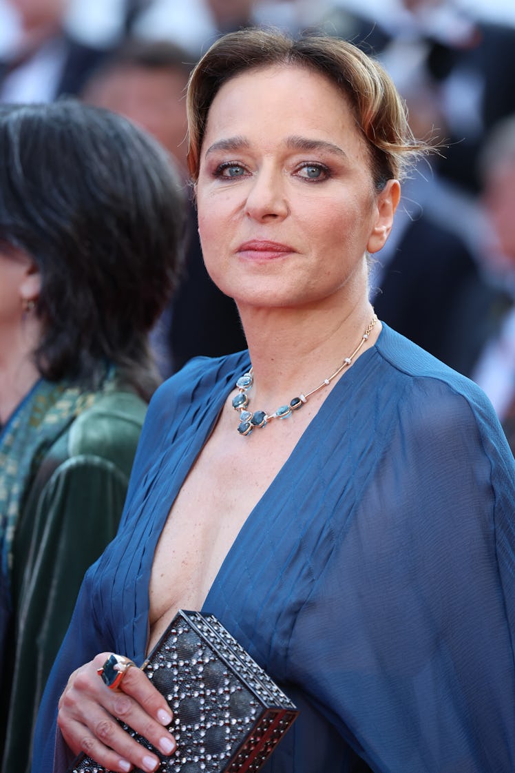 Valeria Golino at the screening of Final Cut in a sheer blue gown and a necklace with blue stones 