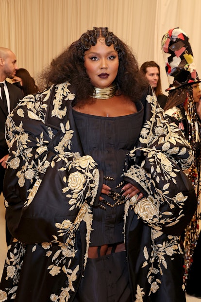 Lizzo wears a deep dark lipstick with matching smoky eye at the 2022 Met Gala Celebrating "In Americ...