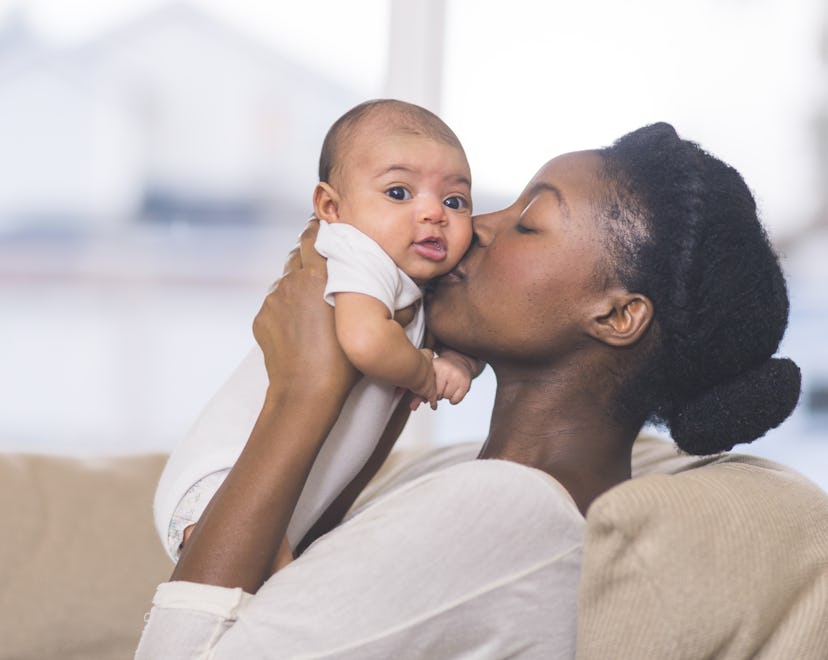 a mother celebrating her first mother's day with her baby