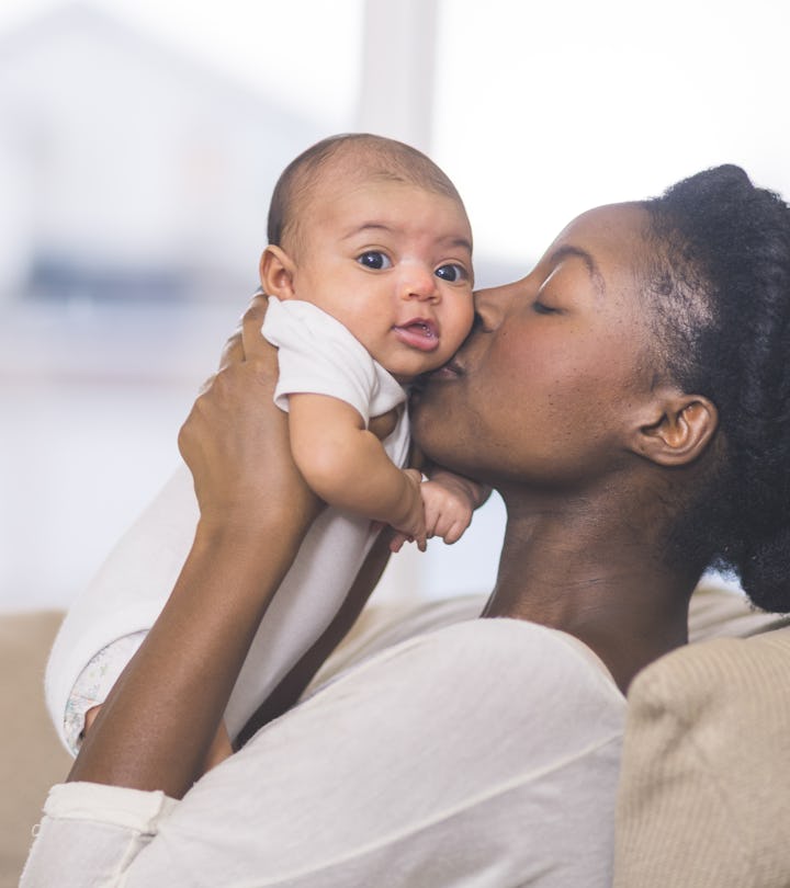 a mother celebrating her first mother's day with her baby