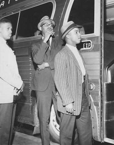 A photograph of three young men boarding a bus, they were part of a group known as the Freedom Rider...