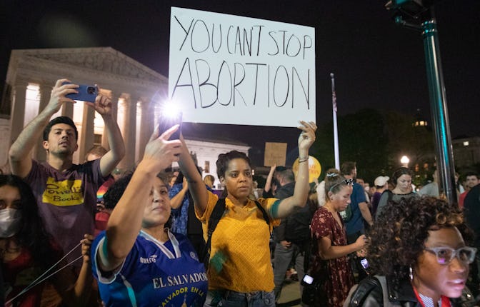 WASHINGTON, D.C. - May 2: Pro-choice protesters rally in front of the Supreme Court after news broke...