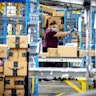 EASTVALE, CA - AUGUST 31: A worker sorts out packages in the outbound dock at Amazon fulfillment cen...