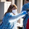SAN DIEGO, CALIFORNIA - MARCH 29: A fan is swabbed at the COVID-19 testing site prior to opening nig...