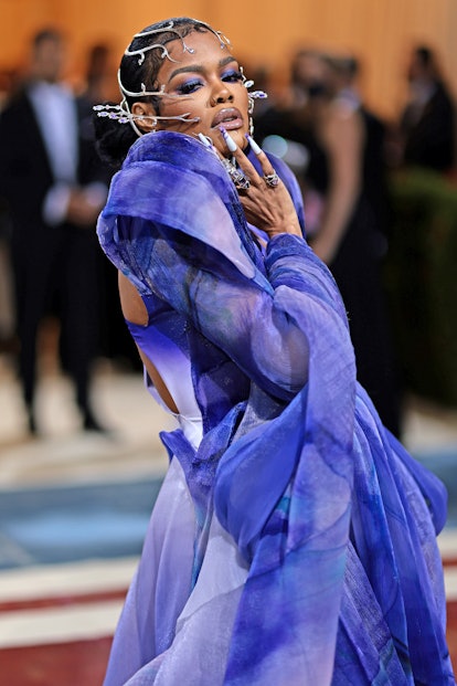 Teyana Taylor's Met Gala hairstyle featured gilded accents.