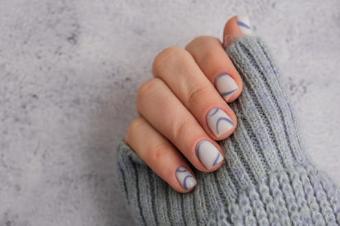 Stylish blue female nails. Modern trendy stylish Beautiful manicure. Autumn winter nail minimalistic...