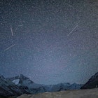 Photo taken on May 4, 2022 shows meteors above the Mount Qomolangma base camp. (Photo by Jiang Fan/X...