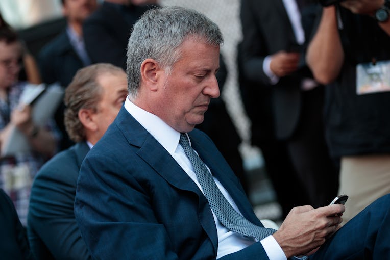 NEW YORK, NY - SEPTEMBER 14: New York City Mayor Bill de Blasio checks his phone during an event t...