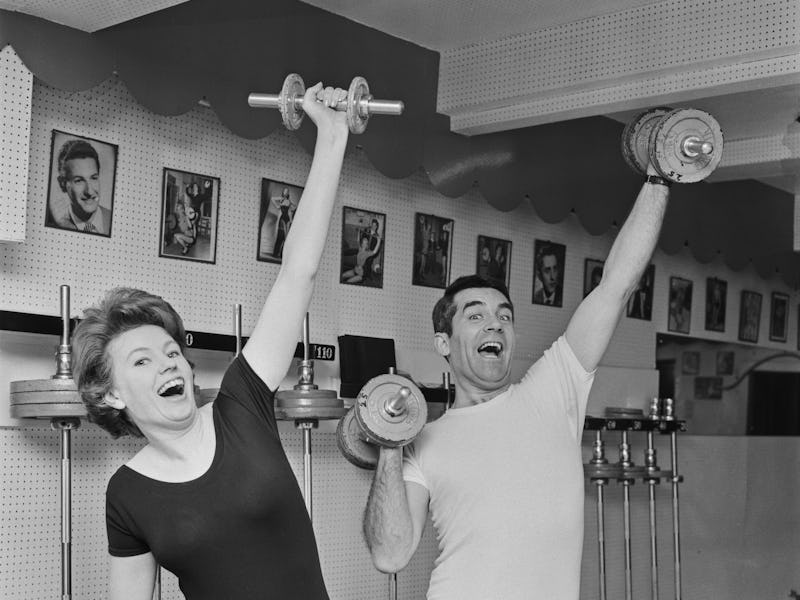 Northern Irish singer Ruby Murray (1935 - 1996, left) working out with weights, UK, 12th April 1965....