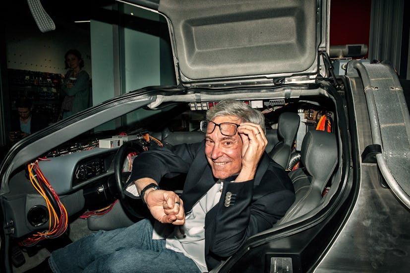 LOS ANGELES, CA - APRIL 20:  Writer Bob Gale sits inside the Delorean at the "Back To The Future" We...