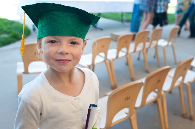 smiling child needs a cute preschool graduation instagram caption