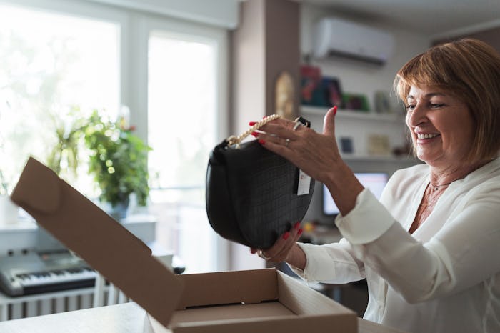 woman unboxing a nice stepmother gift