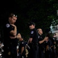 Capitol police officers form a line to separate pro-choice and anti-abortion protesters outside the ...