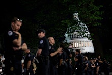 Capitol police officers form a line to separate pro-choice and anti-abortion protesters outside the ...