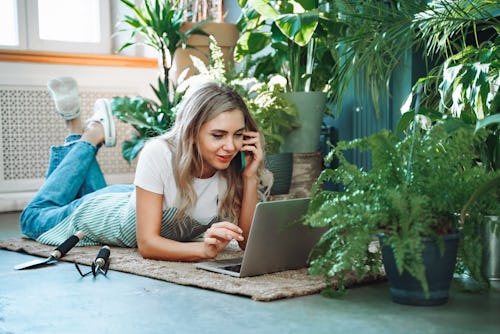 Young female taking orders for flowers and plants. Your spring 2022 mercury retrograde career horos...